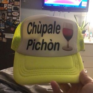 Neon yellow “chúpale pichón” hat!